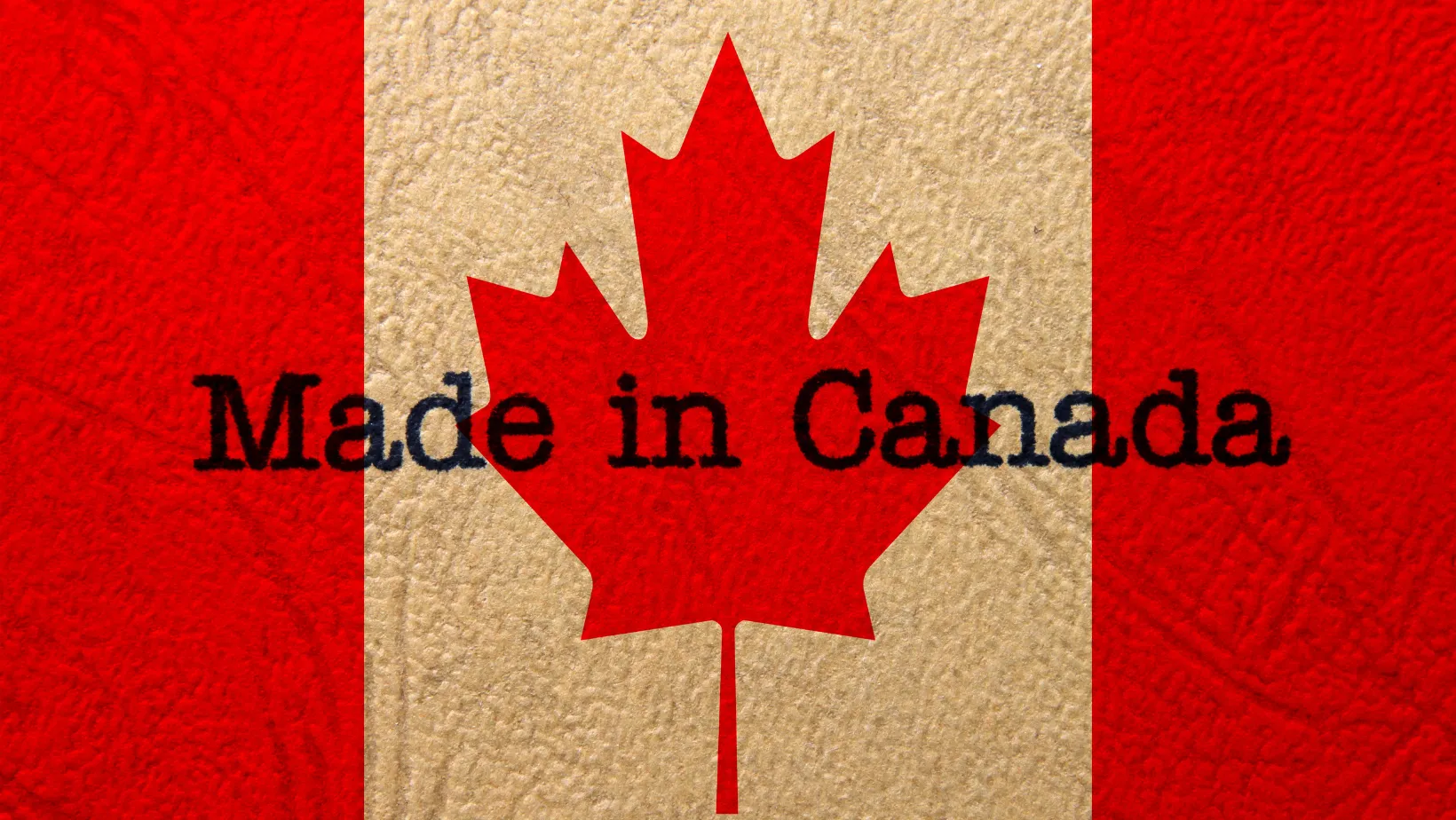 Canadian flag with the words Made in Canada stamped across the maple leaf