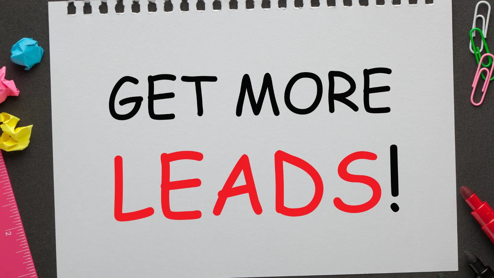 A notepad that reads Get More Leads