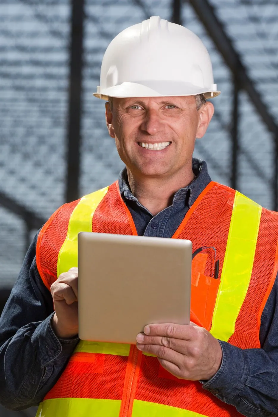 A professional remodeling contractor looks at the camera with a happy face to show his appreciation for the high-intent lead LeadGulls contractor marketing services team generated for him.
