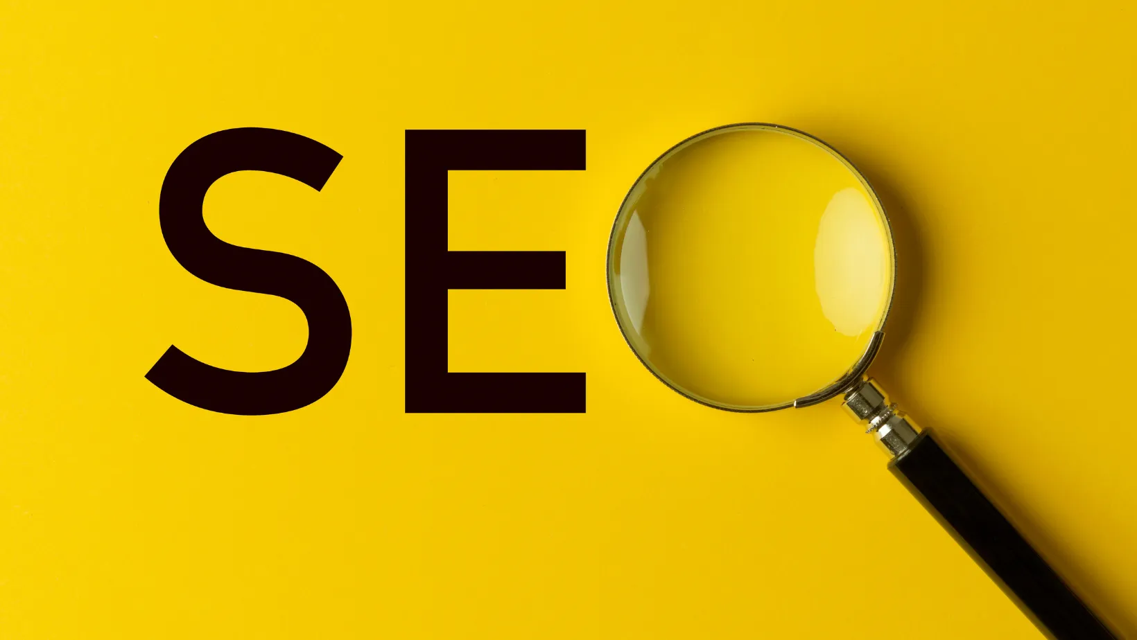 SEO lettering on a yellow background with a magnifying glass as the O