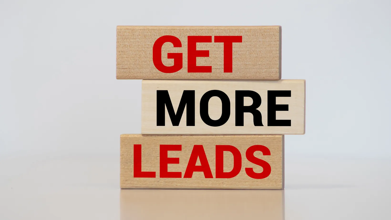 Wooden blocks that read get more leads