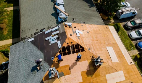 Roofing contractor reviewing PPC lead generation results on a laptop