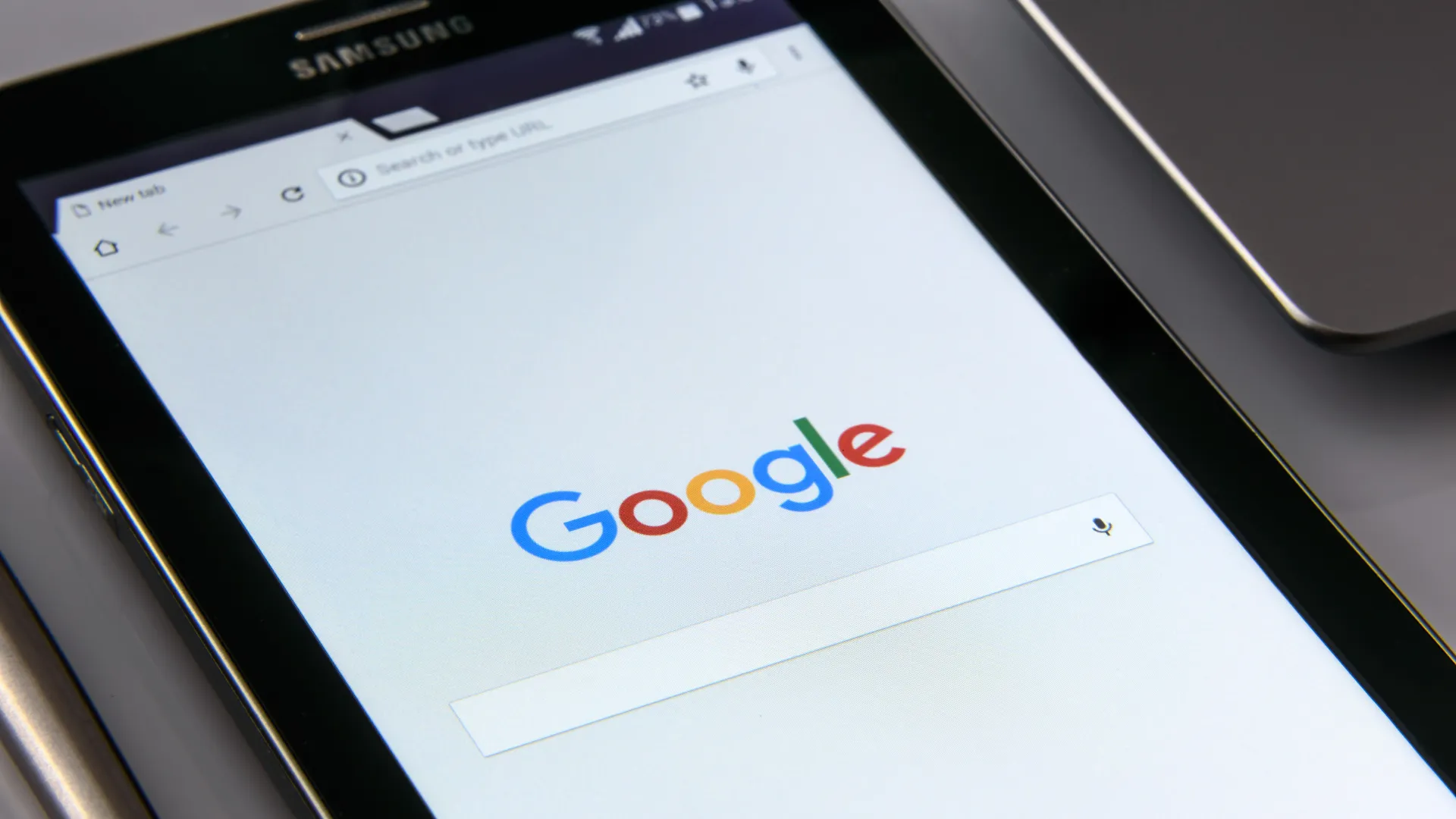 A tablet open to the Google search homepage