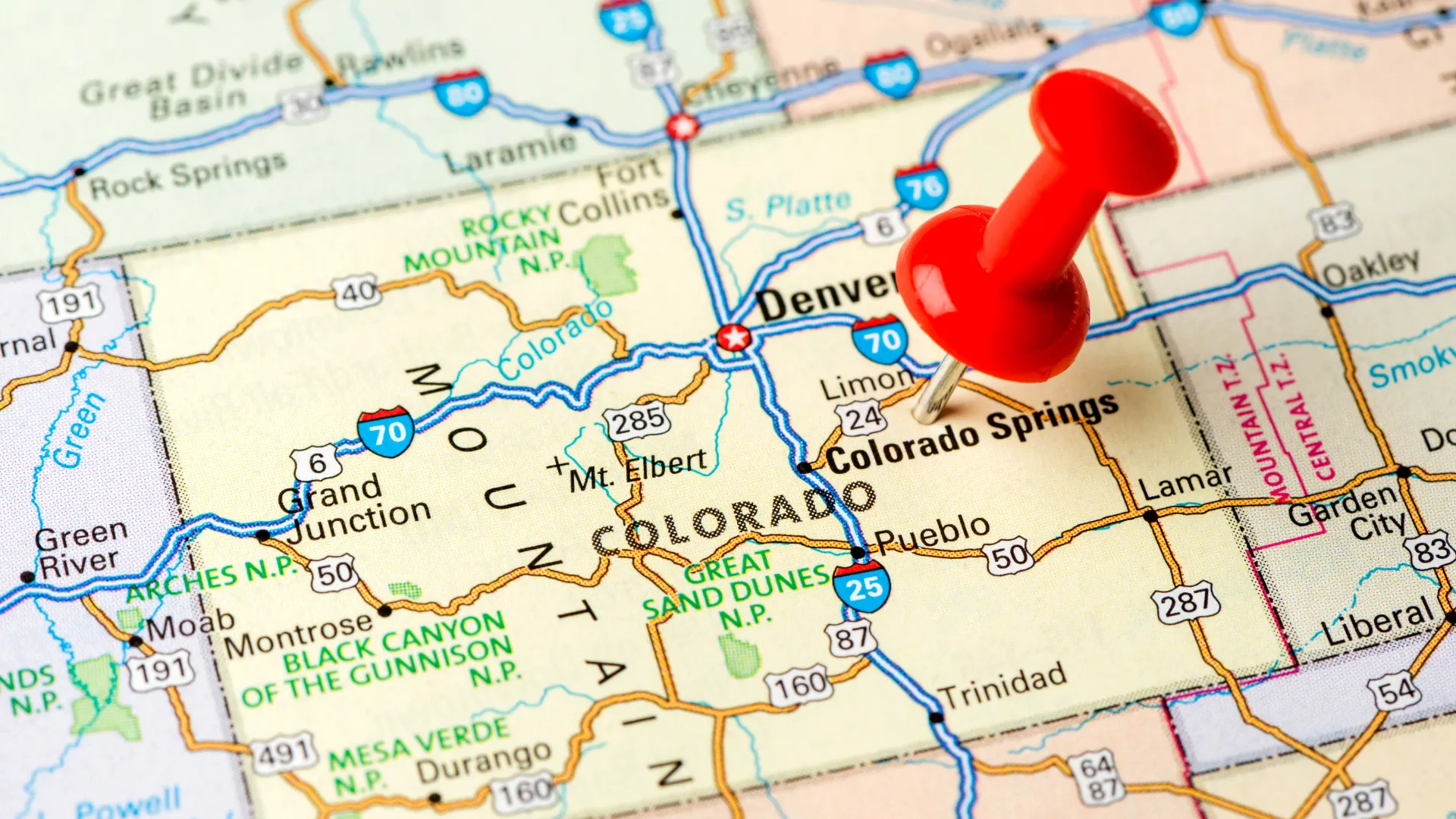 A map of Colorado with a pin between Denver and Colorado Springs