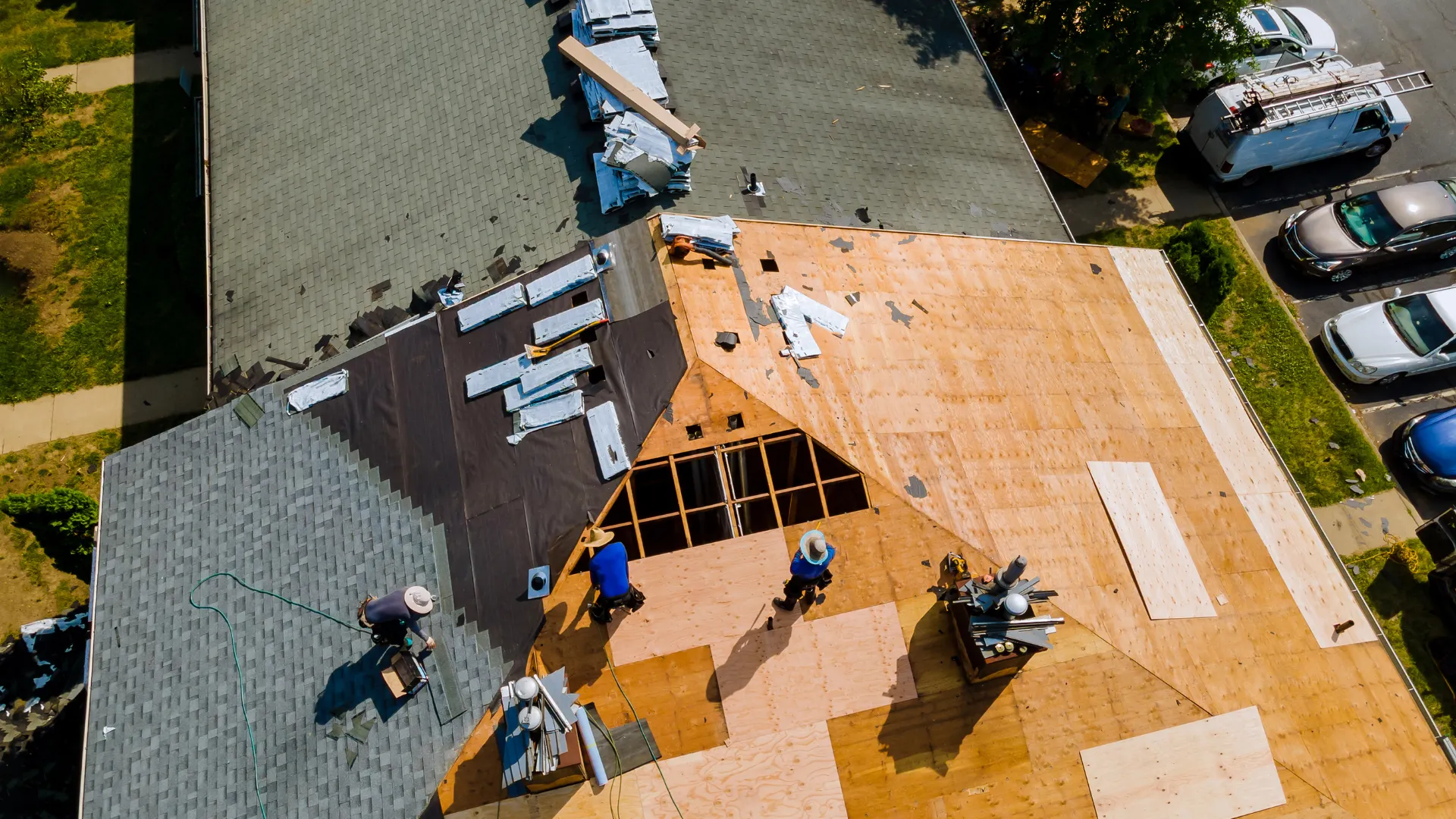 Roofing crew replacing a Las Vegas roof, seen from above