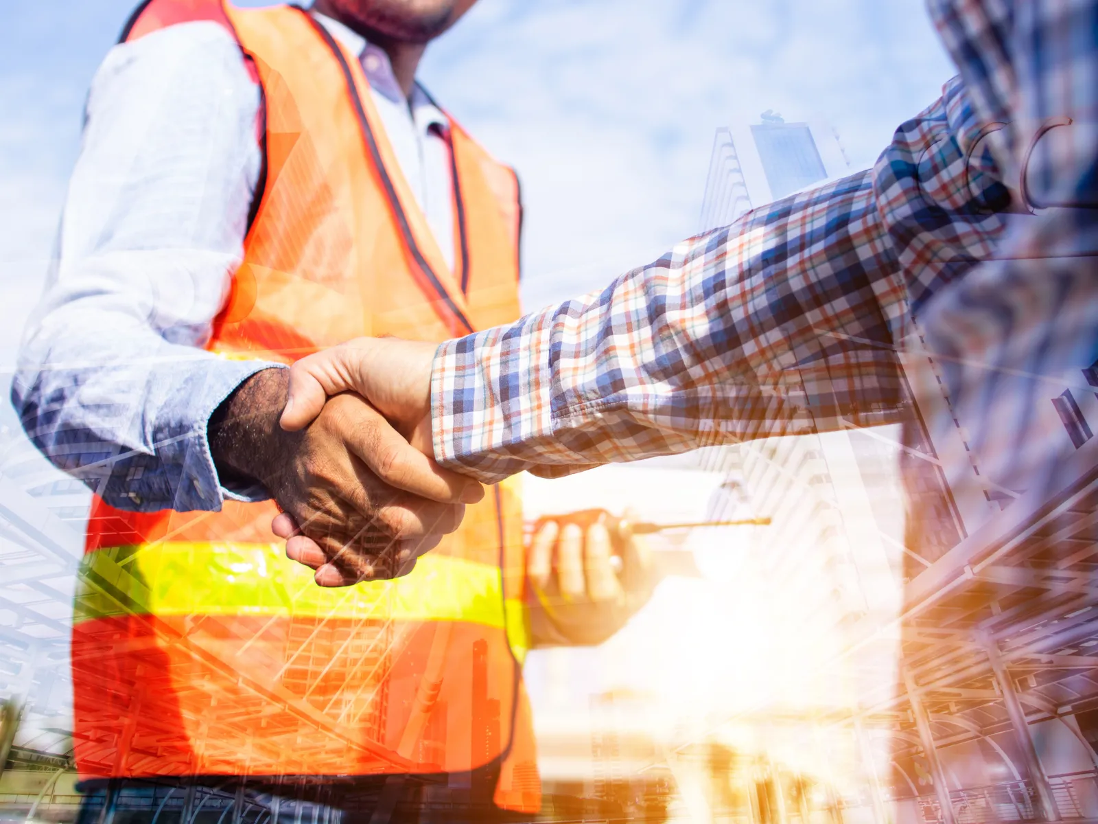 Construction crew and contractors coordinating a residential build project across a Texas metro job site
